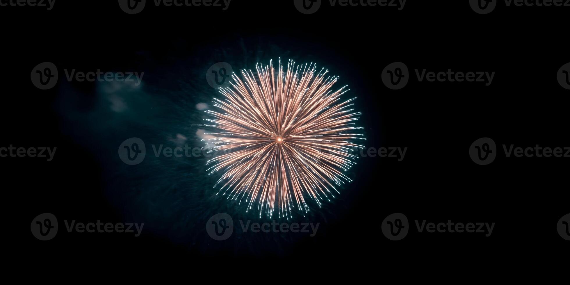 Peach and Teal Fireworks Burst at Night photo