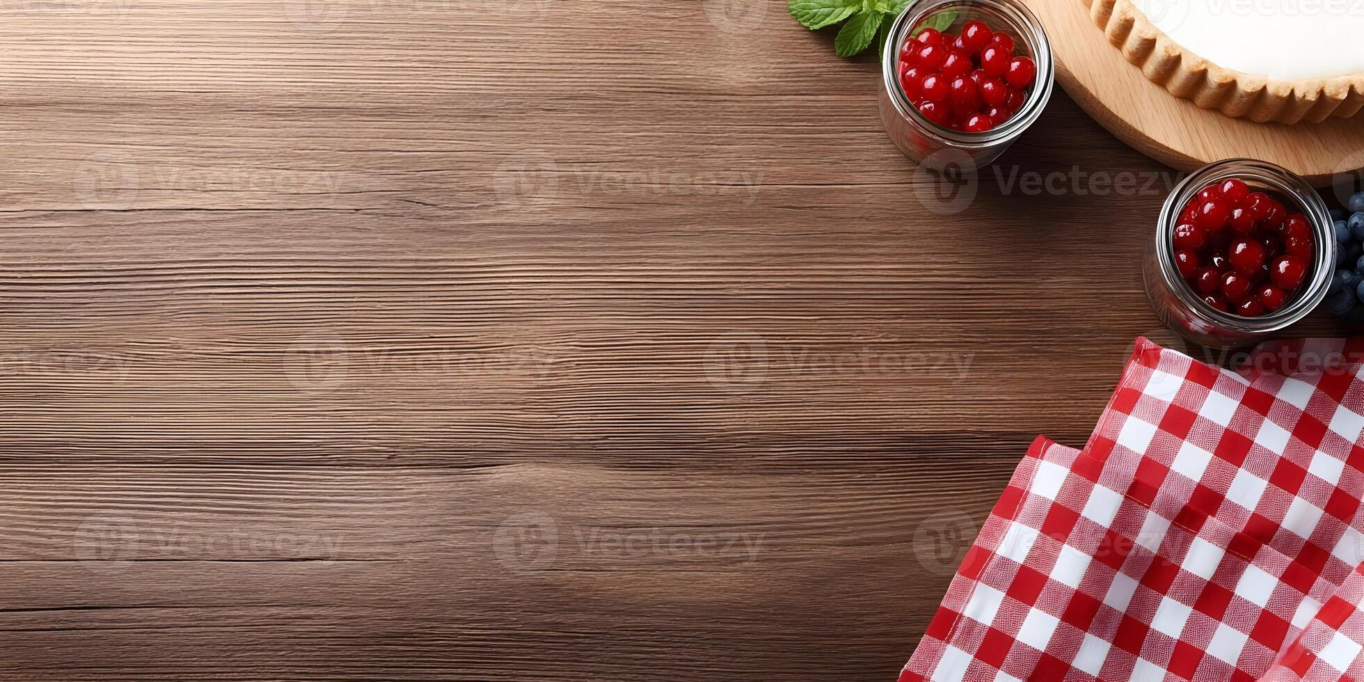Wooden Table Top with Tart Berries and Red Gingham Napkin photo