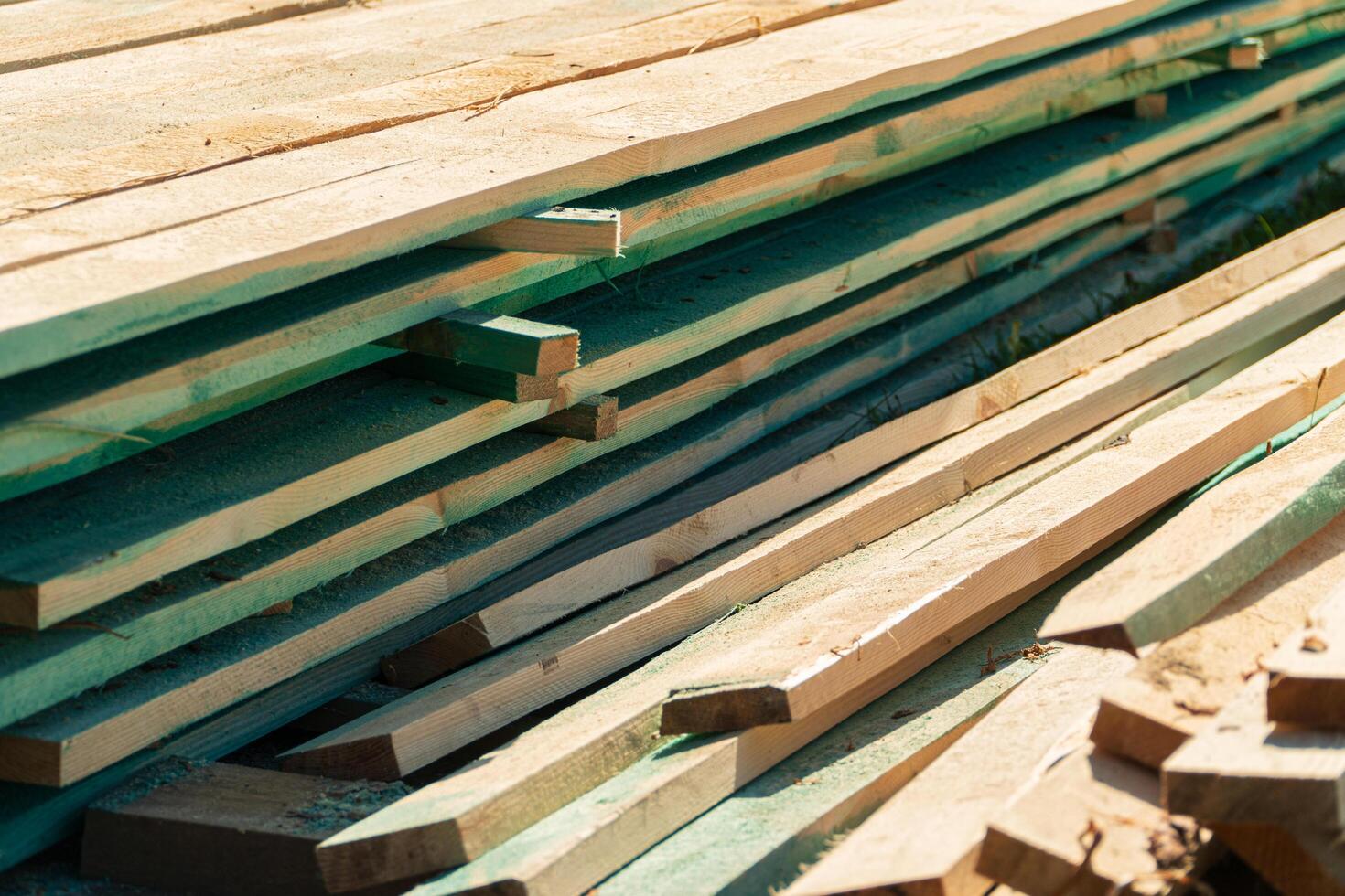 Wood timber in the sawmill. Piles of wooden boards in the sawmill. Wood, timber, wood blanks, construction material. photo
