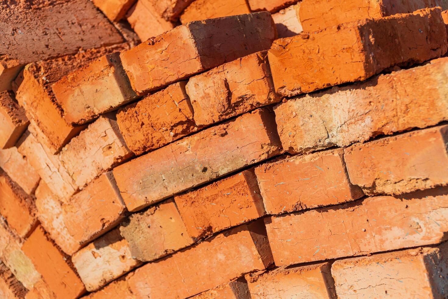 Many red bricks. The bricks is used in construction. Bricks material. Construction concept photo