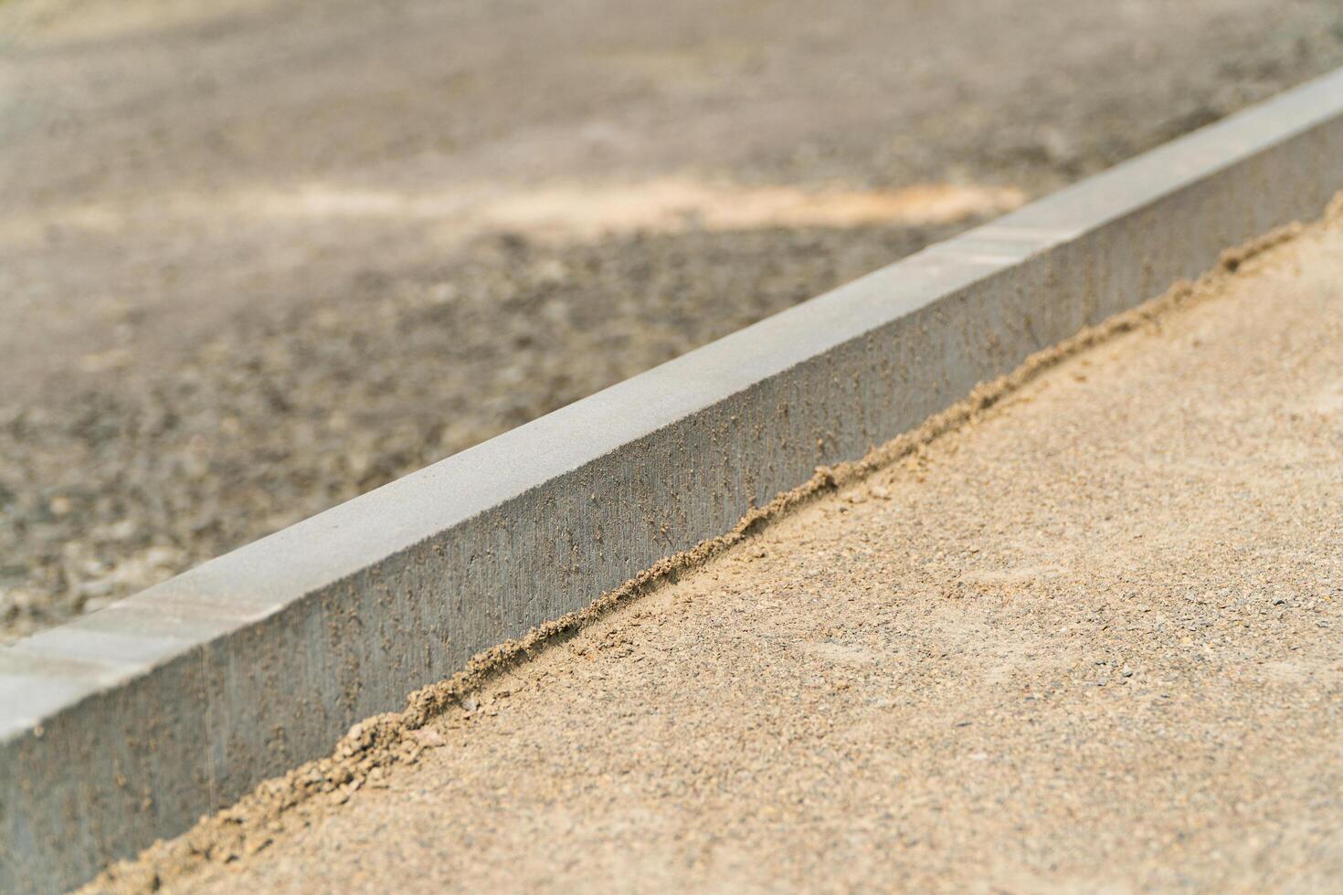 Preparation for laying paving stones. Construction of a pedestrian path. Construction of city roads photo