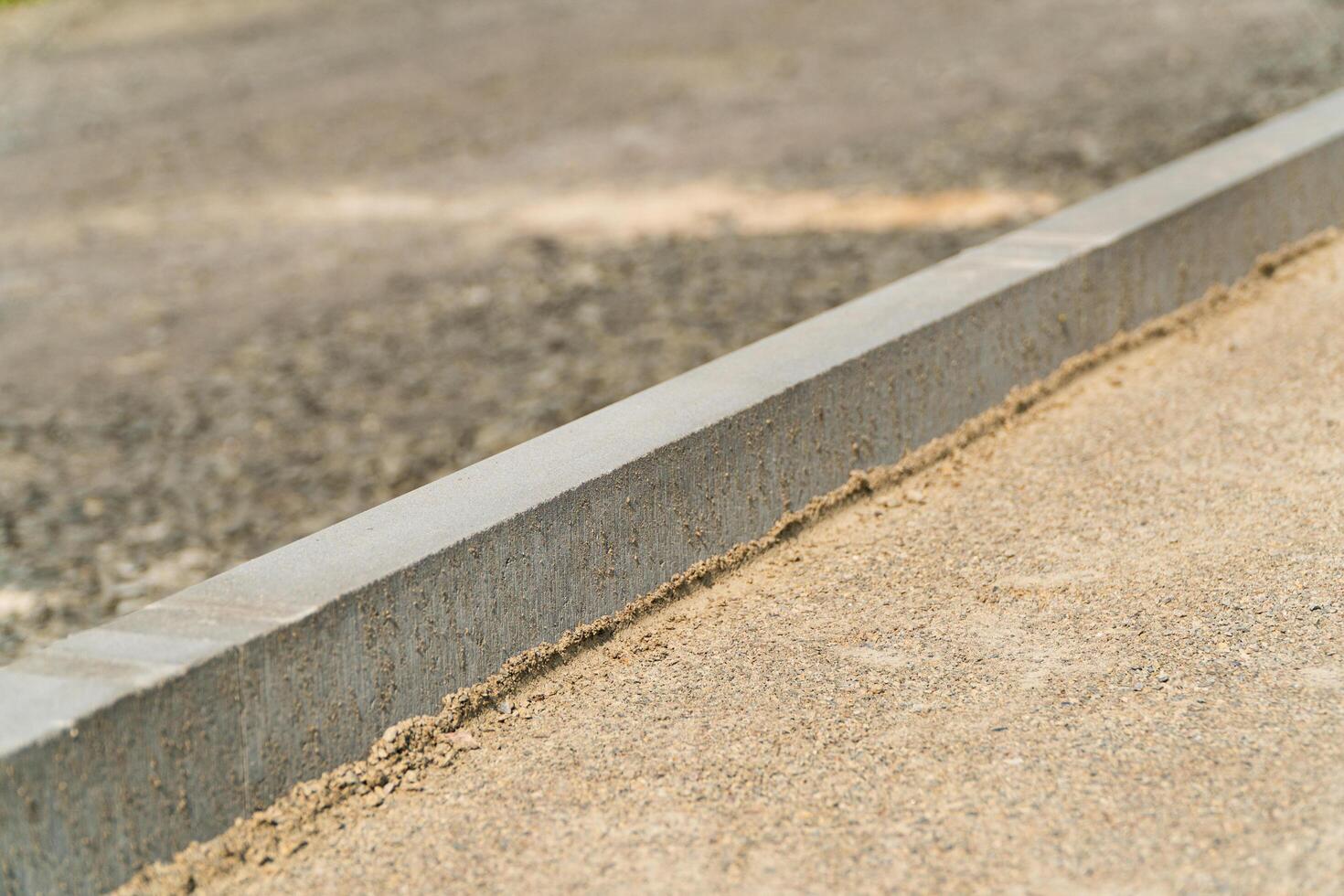 Construction of pedestrian roads. Sidewalk pavement. Laying paving slabs. Street construction photo