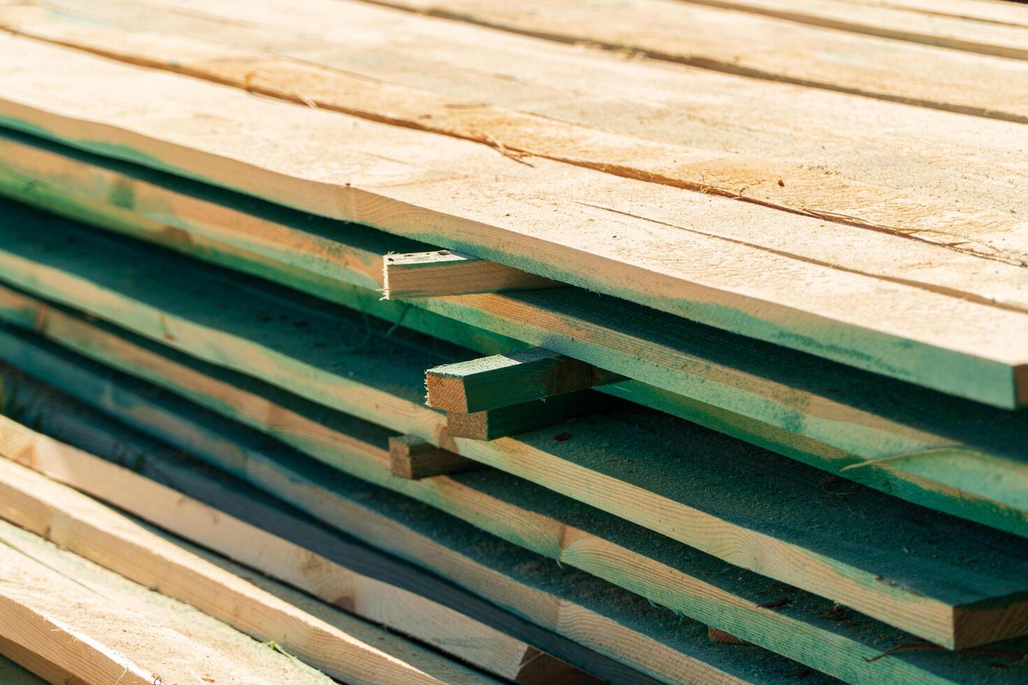 Close-up of stacked boards. Boards for building a house. Boards for roof construction. Boards building material. Construction photo