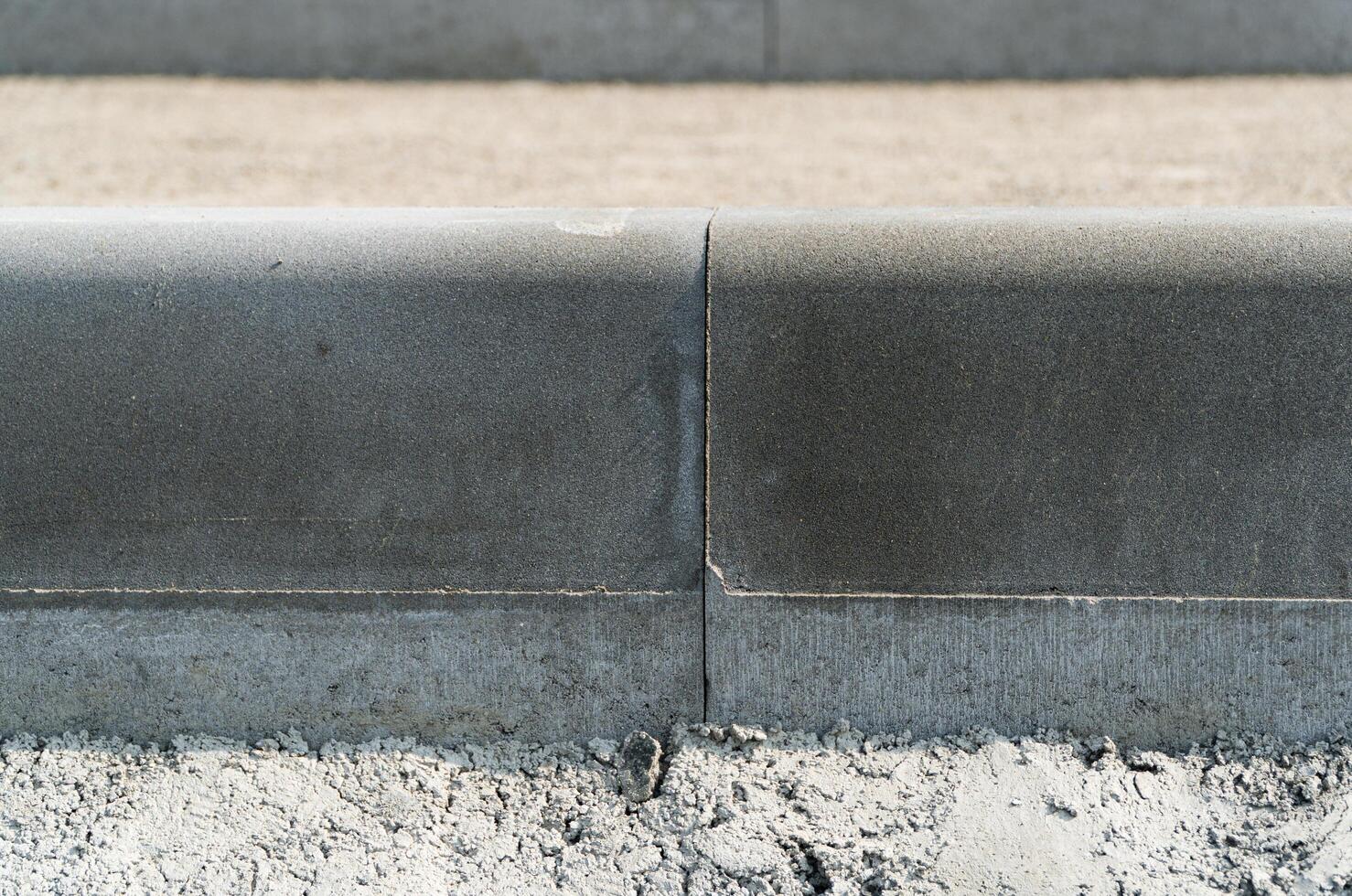 Curbs detail. New curbs close up. Road works. Road curbs and sidewalks photo