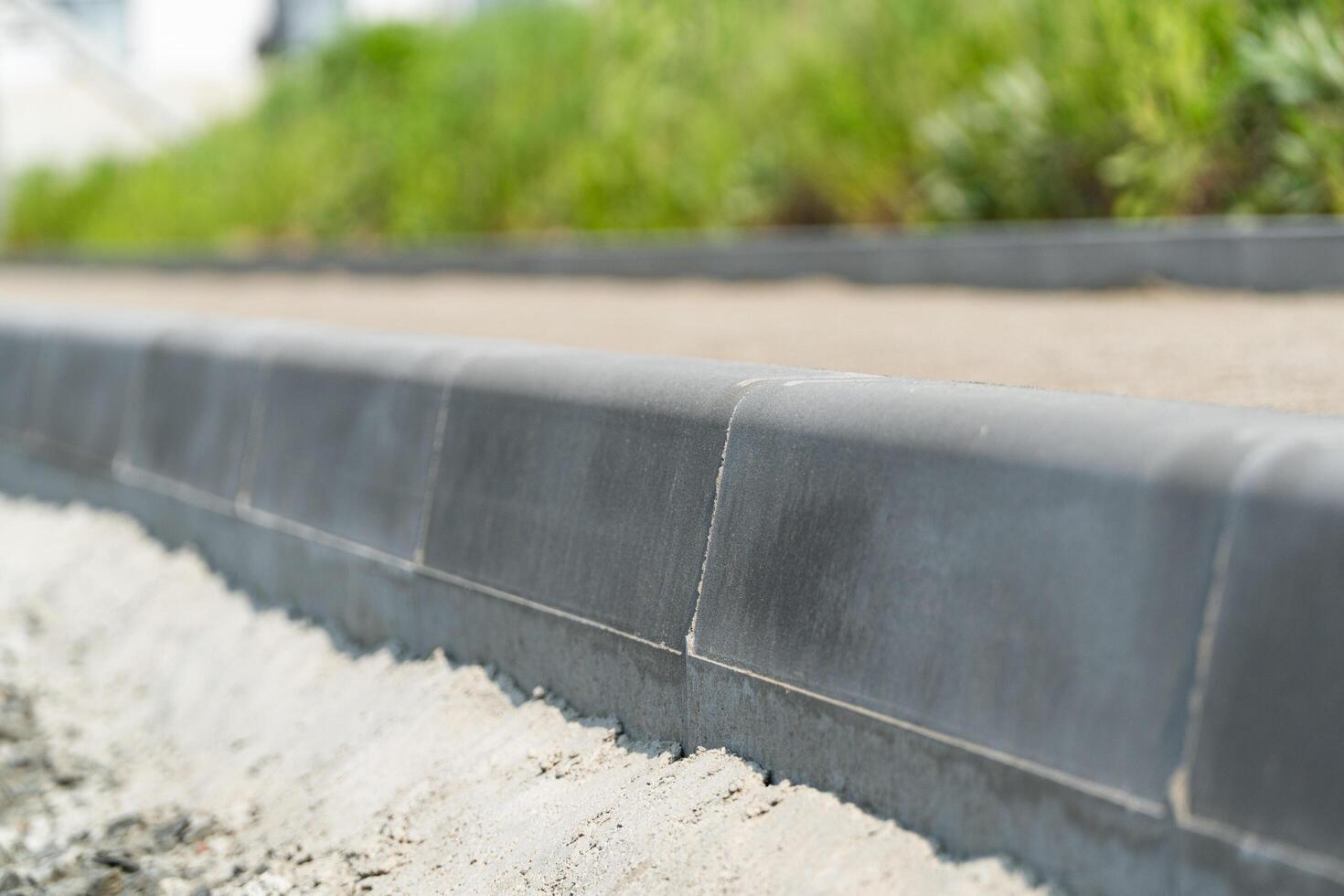 New curbs close up. Road works. Road curbs and sidewalks photo