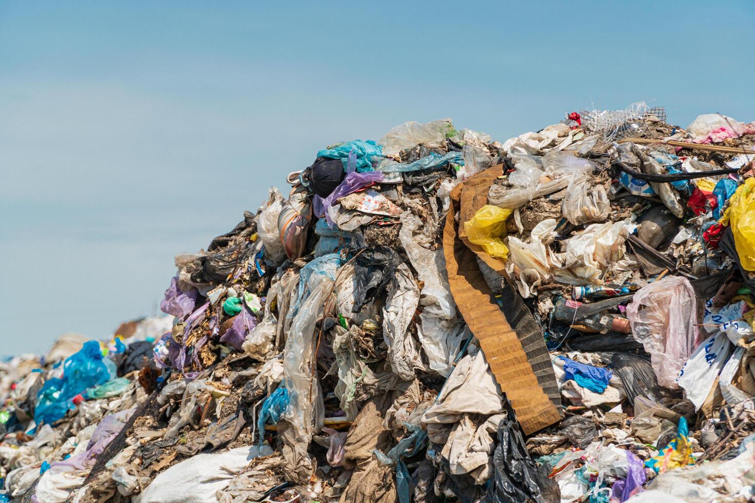 A large pile of garbage close-up. Plastic scrap in landfill. Concept of ecology photo
