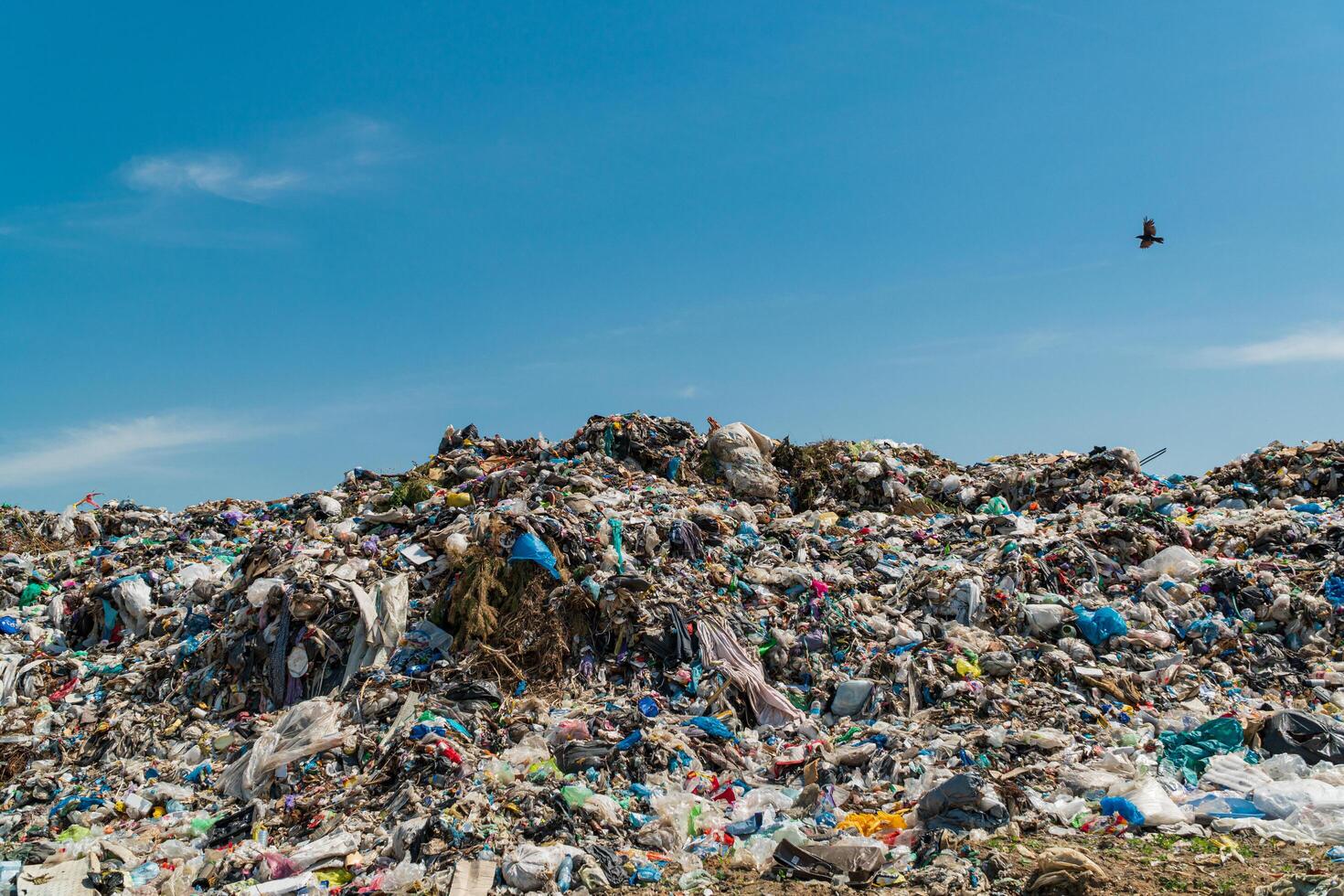 Mountain large garbage pile and pollution. landscape with garbage dump photo
