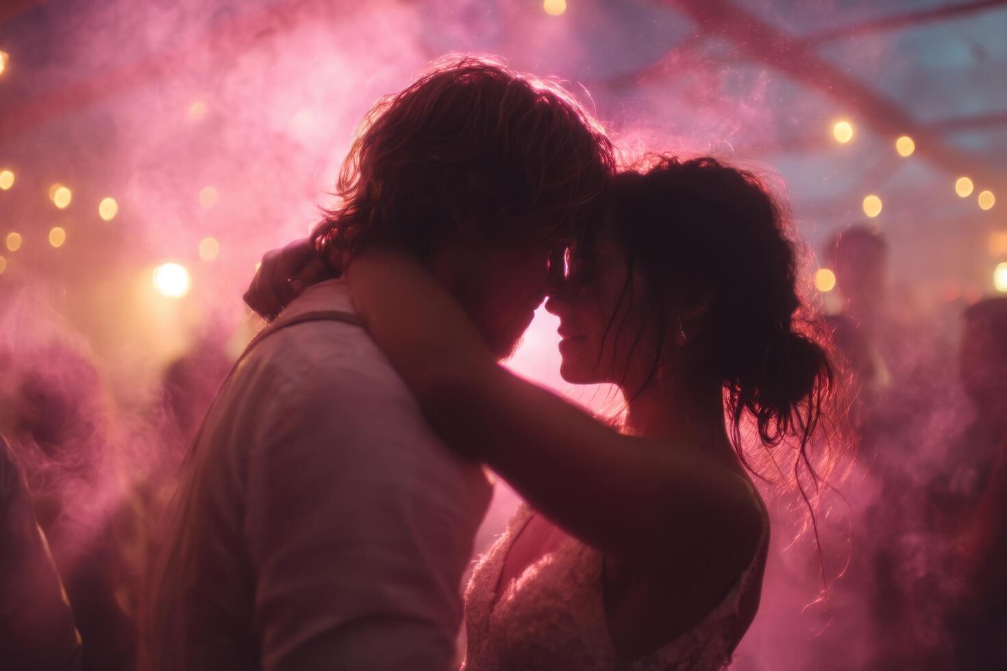 A bride and groom embrace in the smoke at their wedding photo