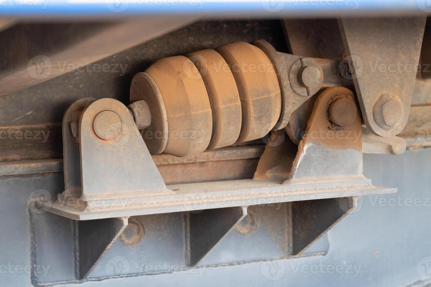 Suspension system inspection industrial site mechanical component close-up view engineering concept photo