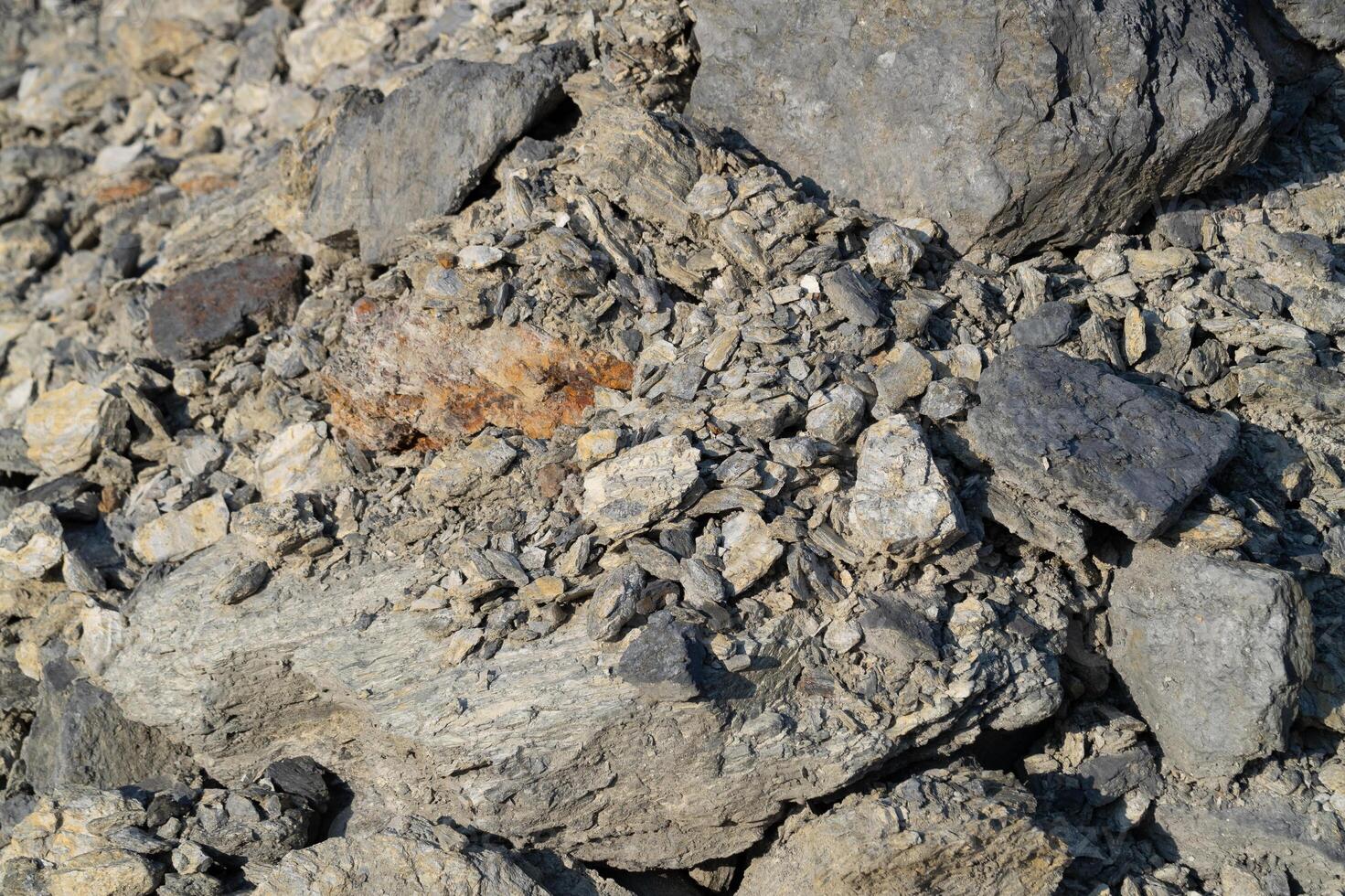 Rock fragmentation process quarry site geological study outdoor environment close-up view natural resources management photo