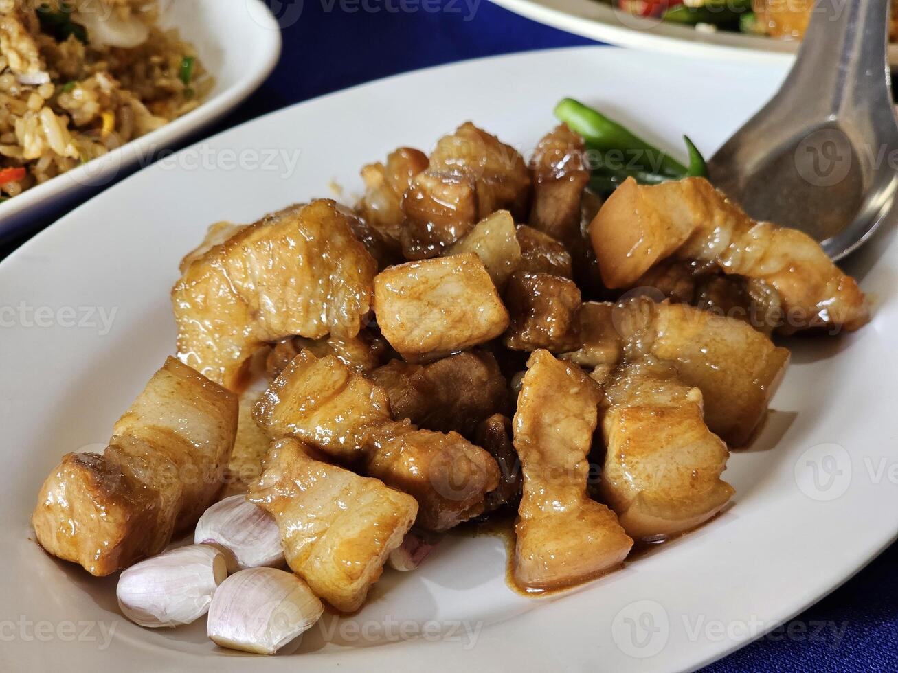 Savory pork dish local market food photography indoor close-up culinary delights photo