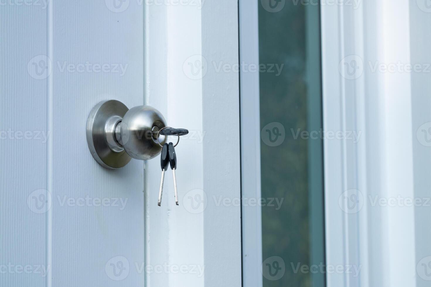 Unlocking new beginnings keys in door lock home entrance still life indoor close-up security photo