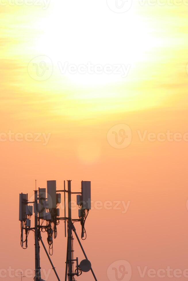 Telecommunication tower at sunset urban landscape photograph evening sky silhouette technology impact photo