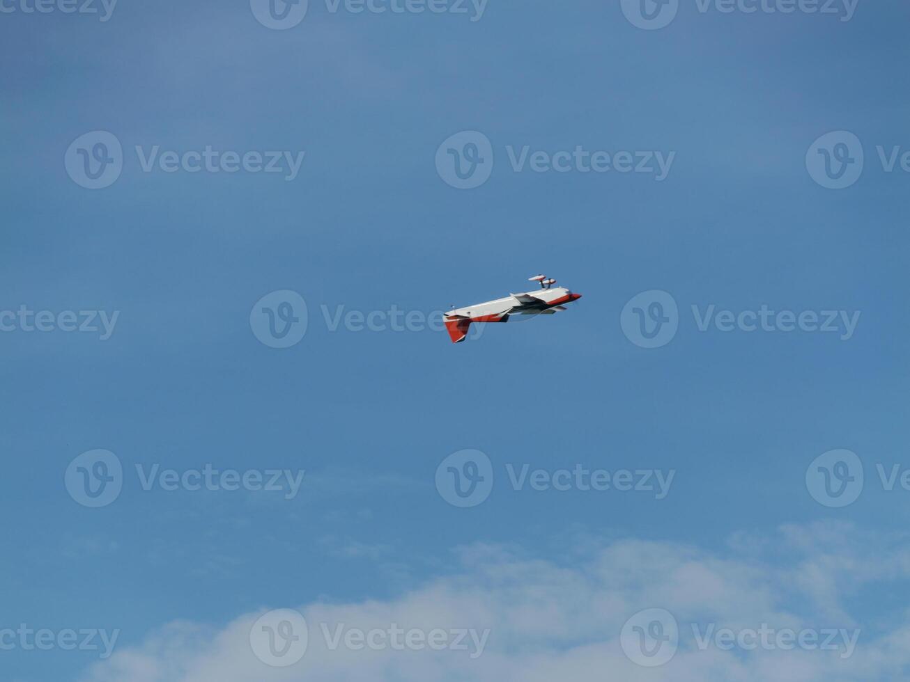 Aircraft in flight open sky aerial photography blue atmosphere high angle aviation dynamics photo