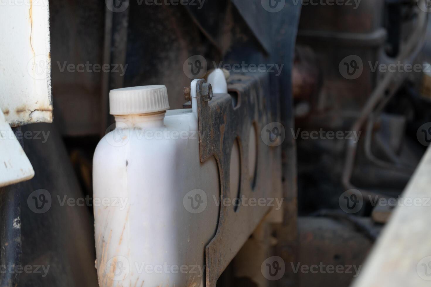 Maintenance action vehicle engine compartment close-up image industrial setting macro view automotive concept photo