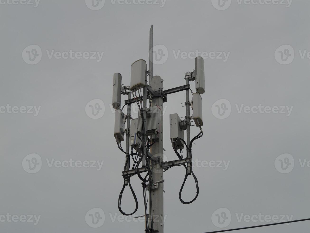 Telecommunication infrastructure installation urban setting technology structure cloudy atmosphere elevated perspective connectivity concept photo