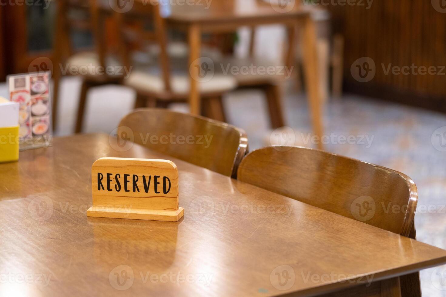 Reserved table sign action restaurant location interior content type cozy environment close-up viewpoint dining concept photo