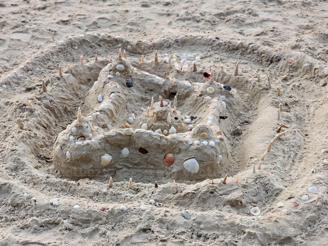 Creative sandcastle building beach artistic creation sandy environment close-up view imagination at play photo