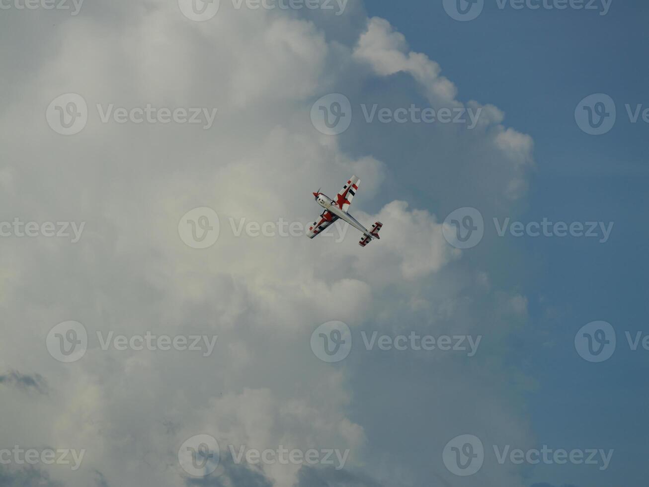 Aerobatic maneuvers showcase open sky aerial photography cloudy environment high angle aviation excitement photo