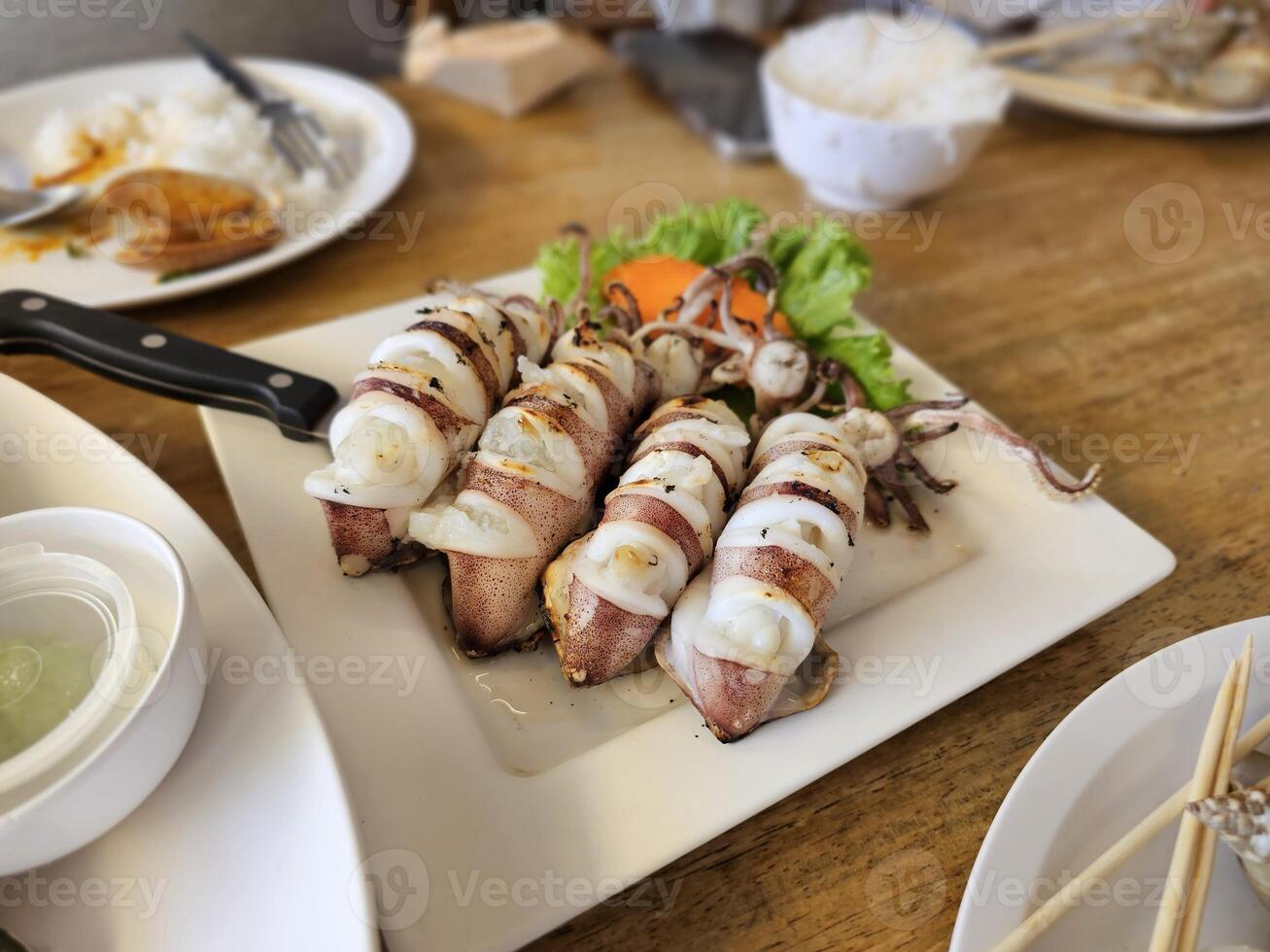 Grilled squid dish local seafood restaurant food photography casual dining close-up view culinary delight photo