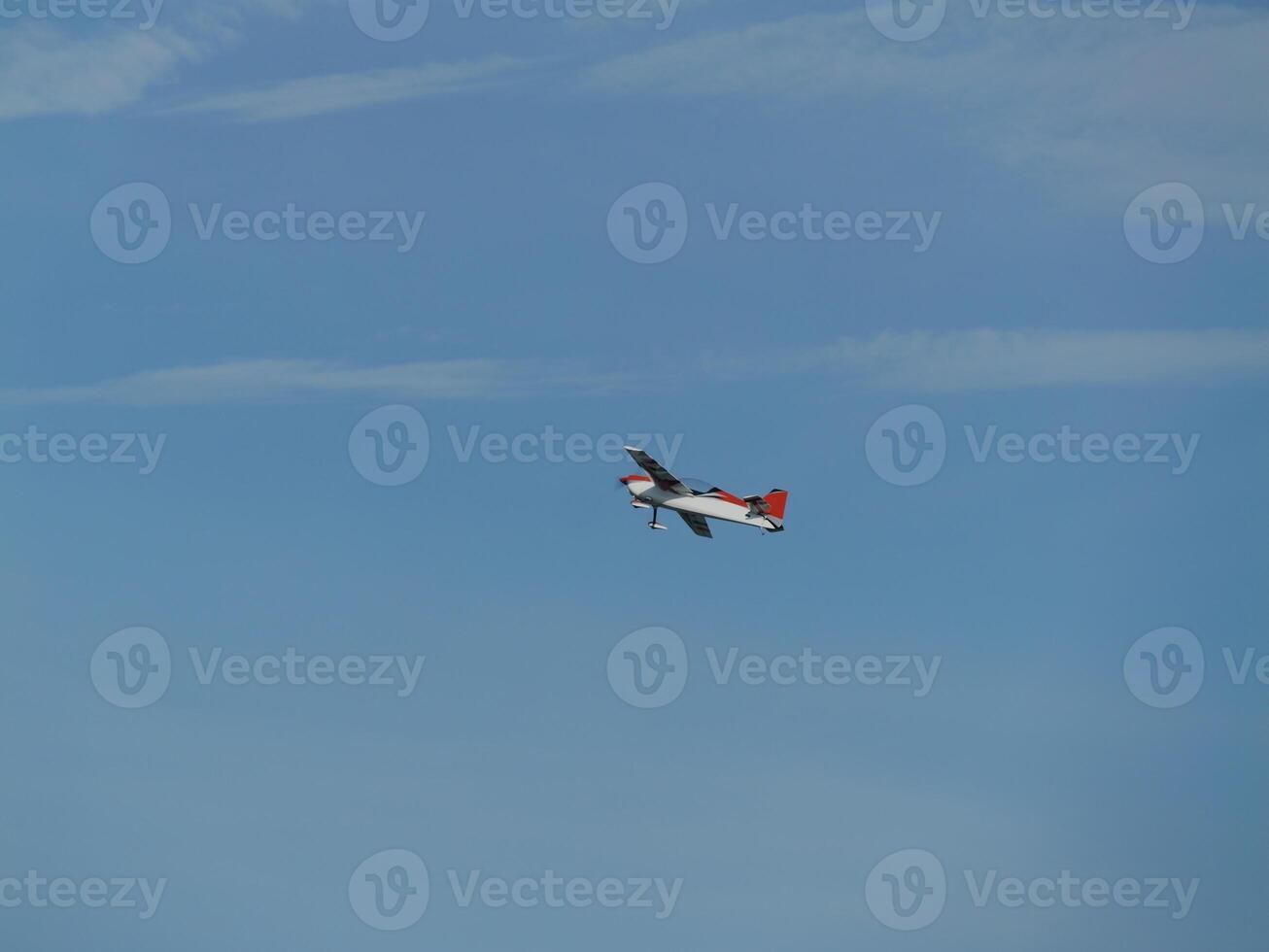 Aerial maneuvering airplane clear sky aviation photography outdoor high angle flight dynamics photo