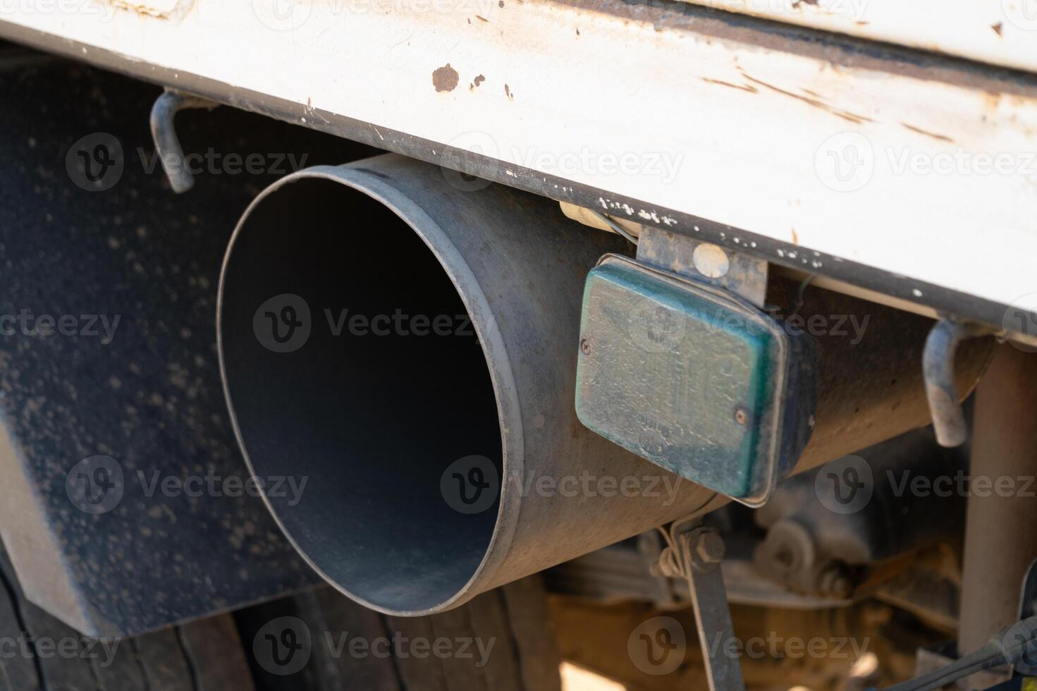 Truck exhaust system industrial setting vehicle component close-up technical analysis photo