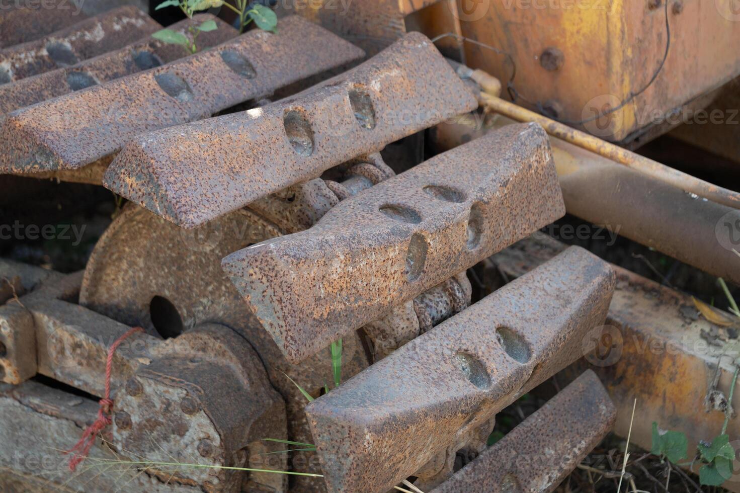 Heavy machinery action construction site close-up industrial environment ground level metal wear and tear photo