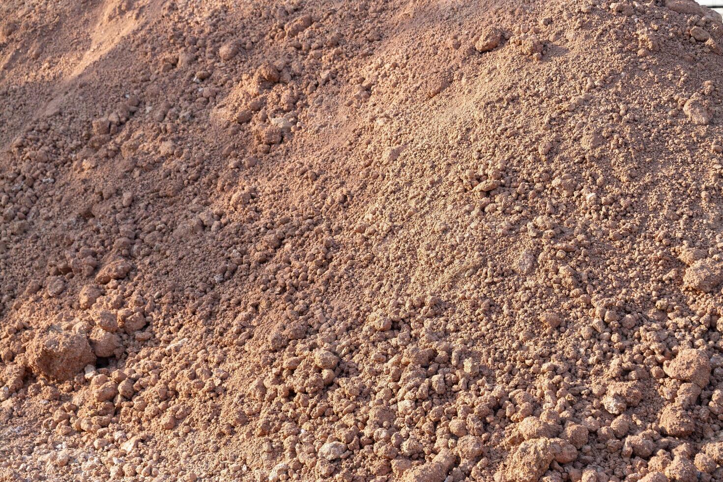 Construction activity dirt pile outdoor site natural environment ground level view earth materials for building projects photo