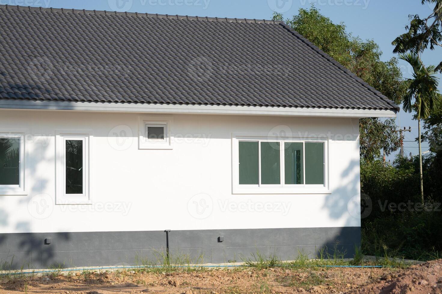 New modern house construction residential area exterior view suburban setting daylight contemporary design photo