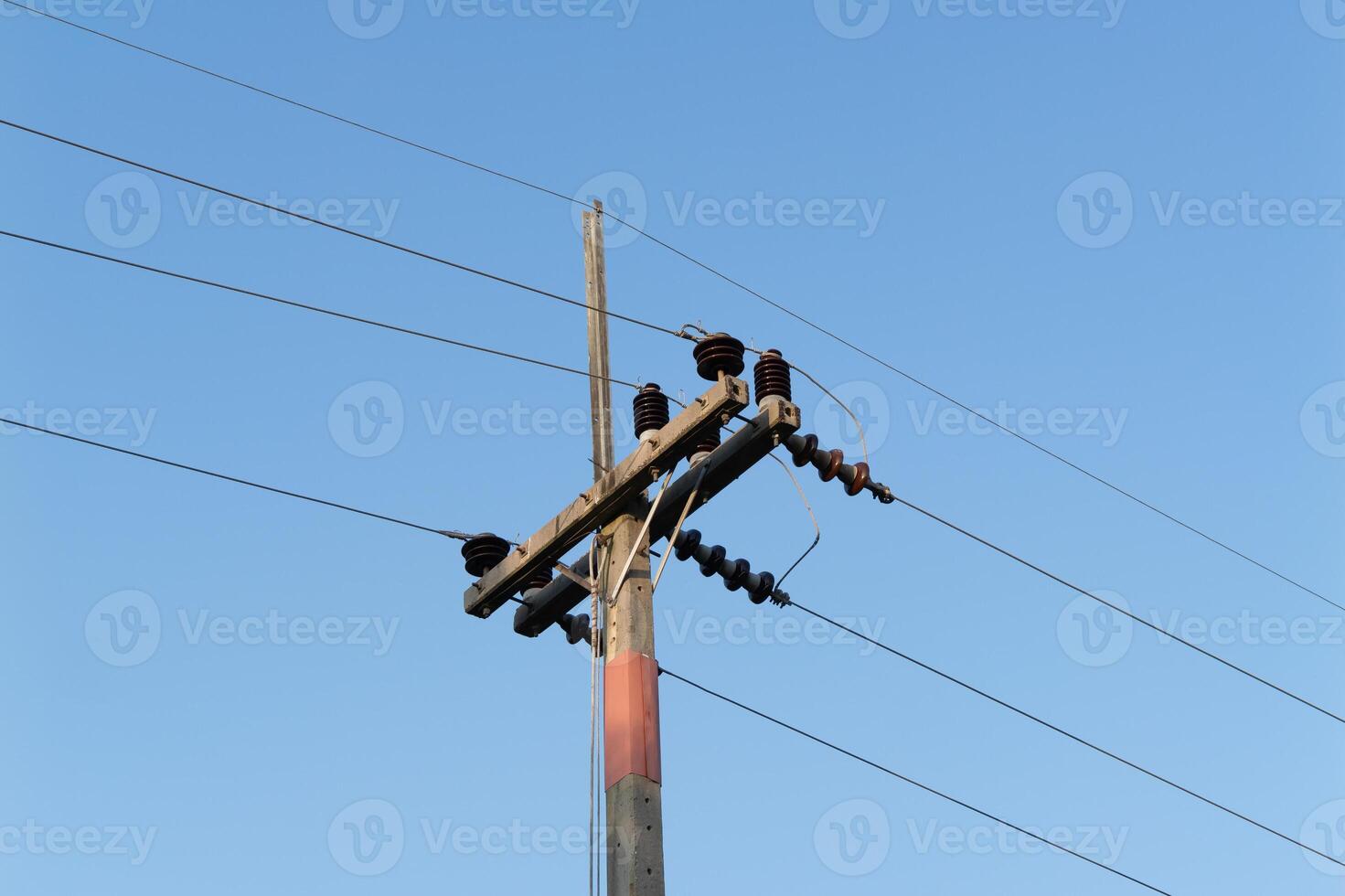 Power line infrastructure urban area electrical equipment clear sky ground view utility maintenance photo