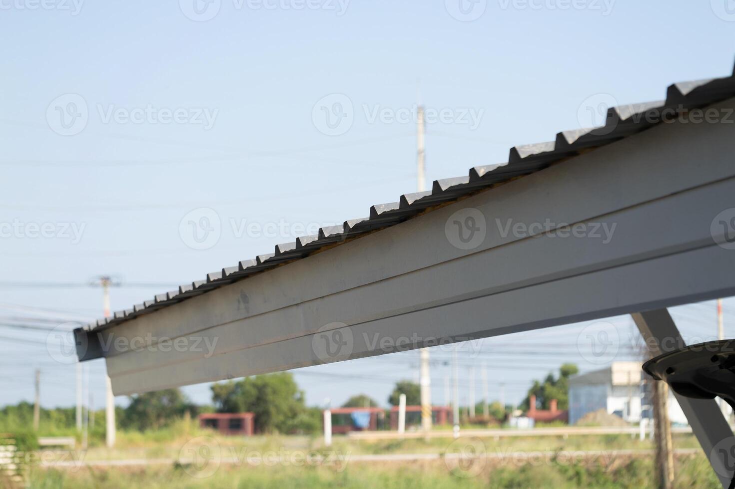 Overhead view of roof edge urban setting architectural detail clear sky dynamic perspective structural integrity photo