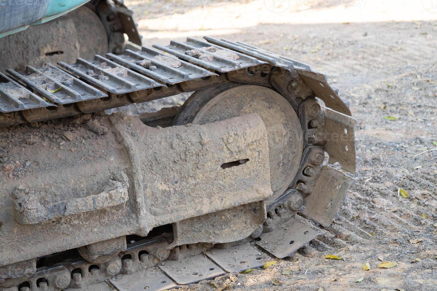Excavation equipment maintenance construction site macro image outdoor environment ground level heavy machinery photo