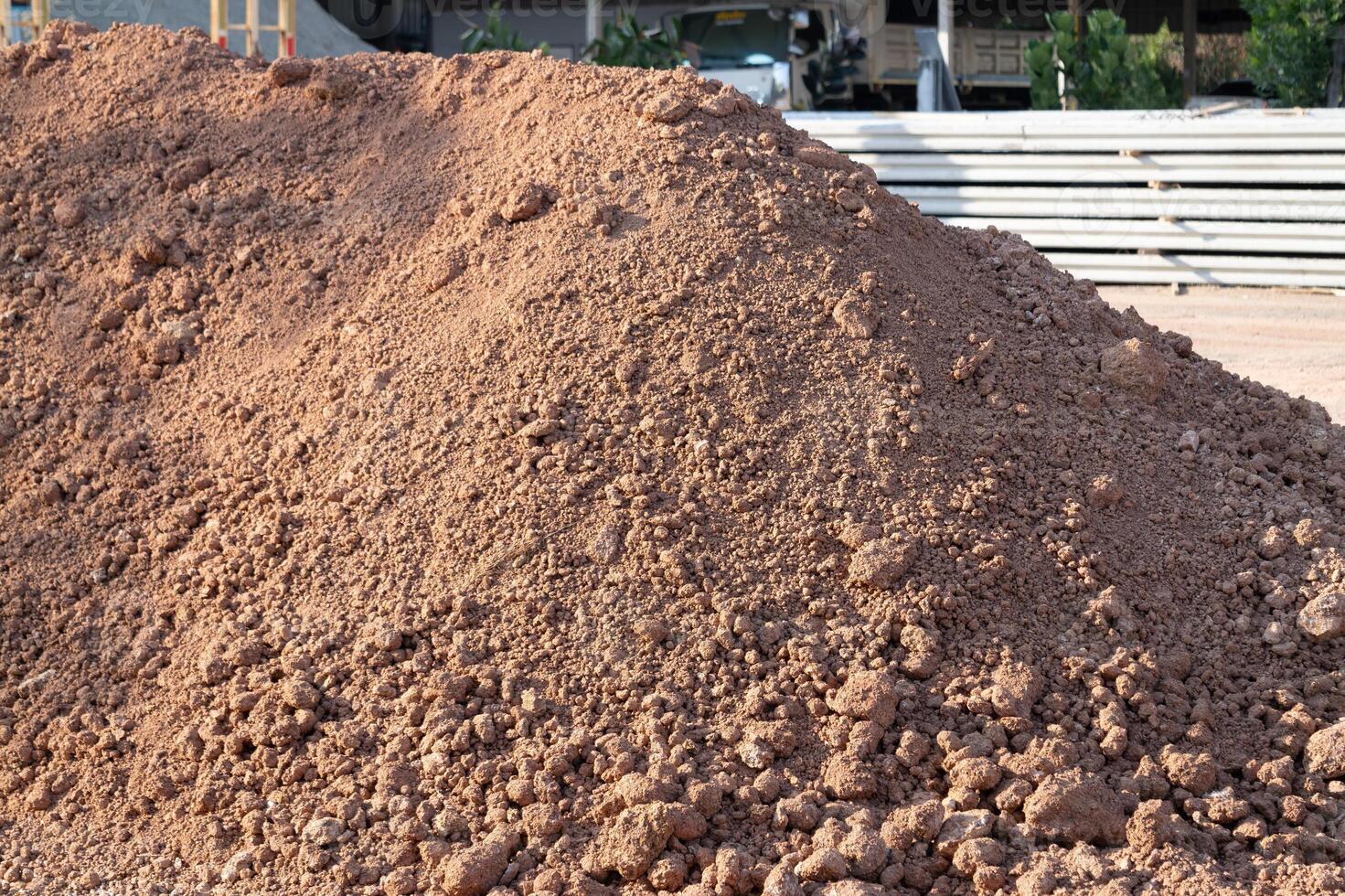 Excavation activity construction site soil pile urban environment ground level material handling photo