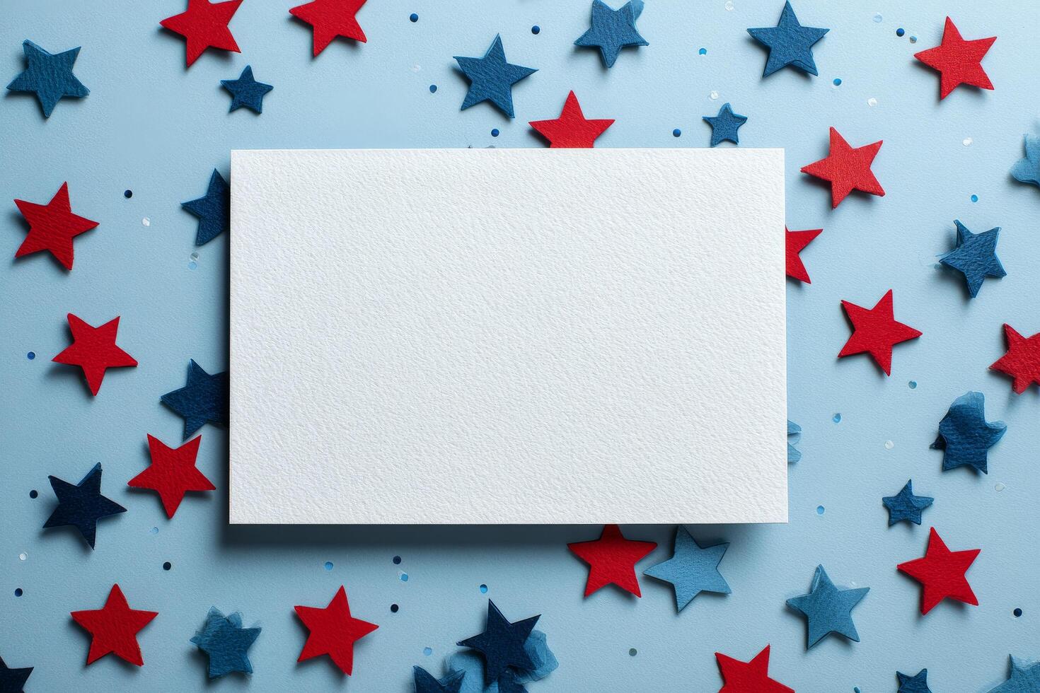 Brightly Colored Stars Surround a Blank Card on a Blue Background for Creative Projects and Celebrations photo