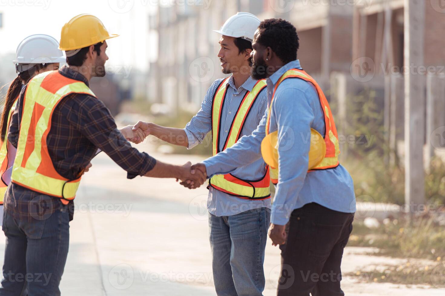 Group of architects and engineers work together to assess the residential home construction site's progress,160 photo