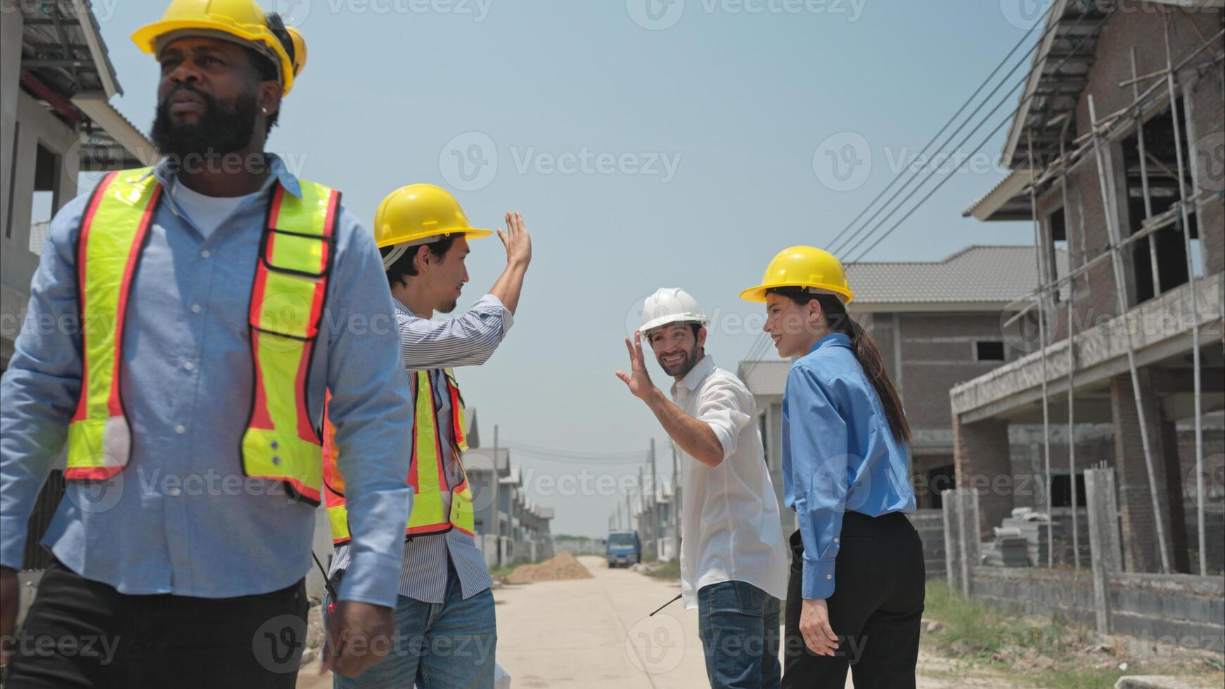 Group of architects and engineers work together to assess the residential home construction site's progress,248 photo
