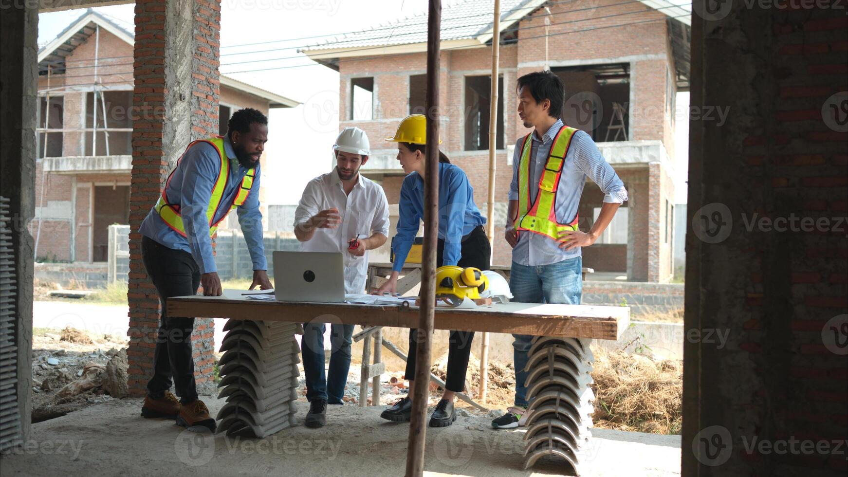 Group of architects and engineers work together to assess the residential home construction site's progress,238 photo