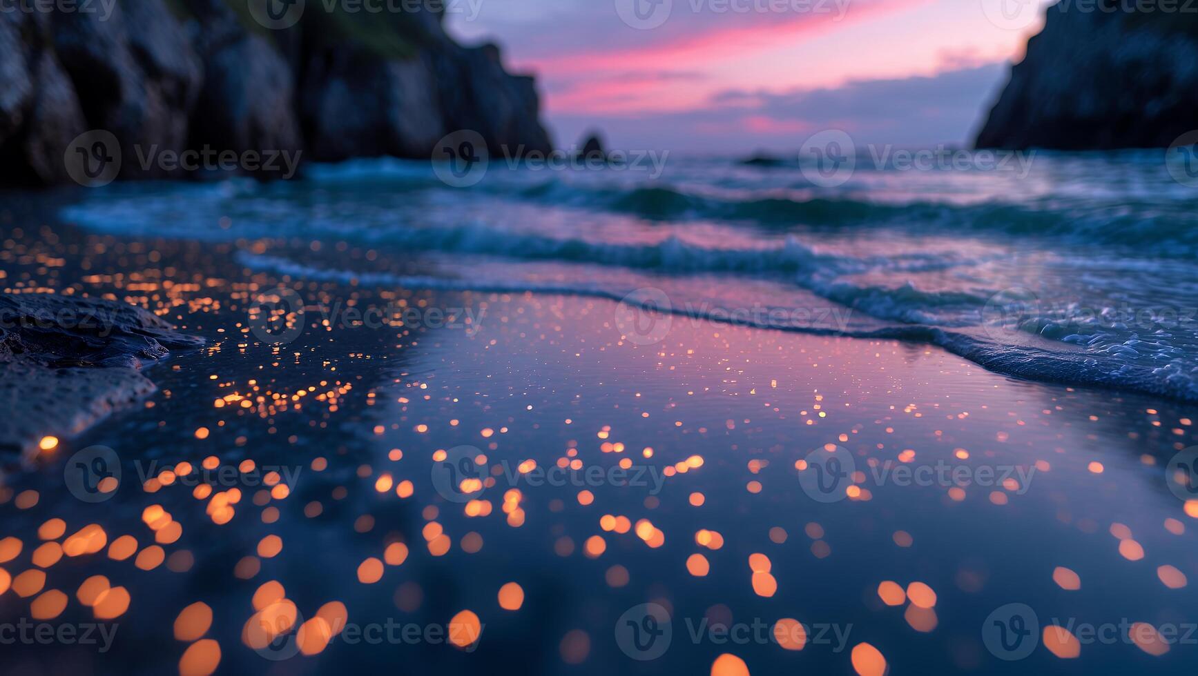 Glowing Ocean Waves on Sandy Beach at Twilight with Colorful Sky photo