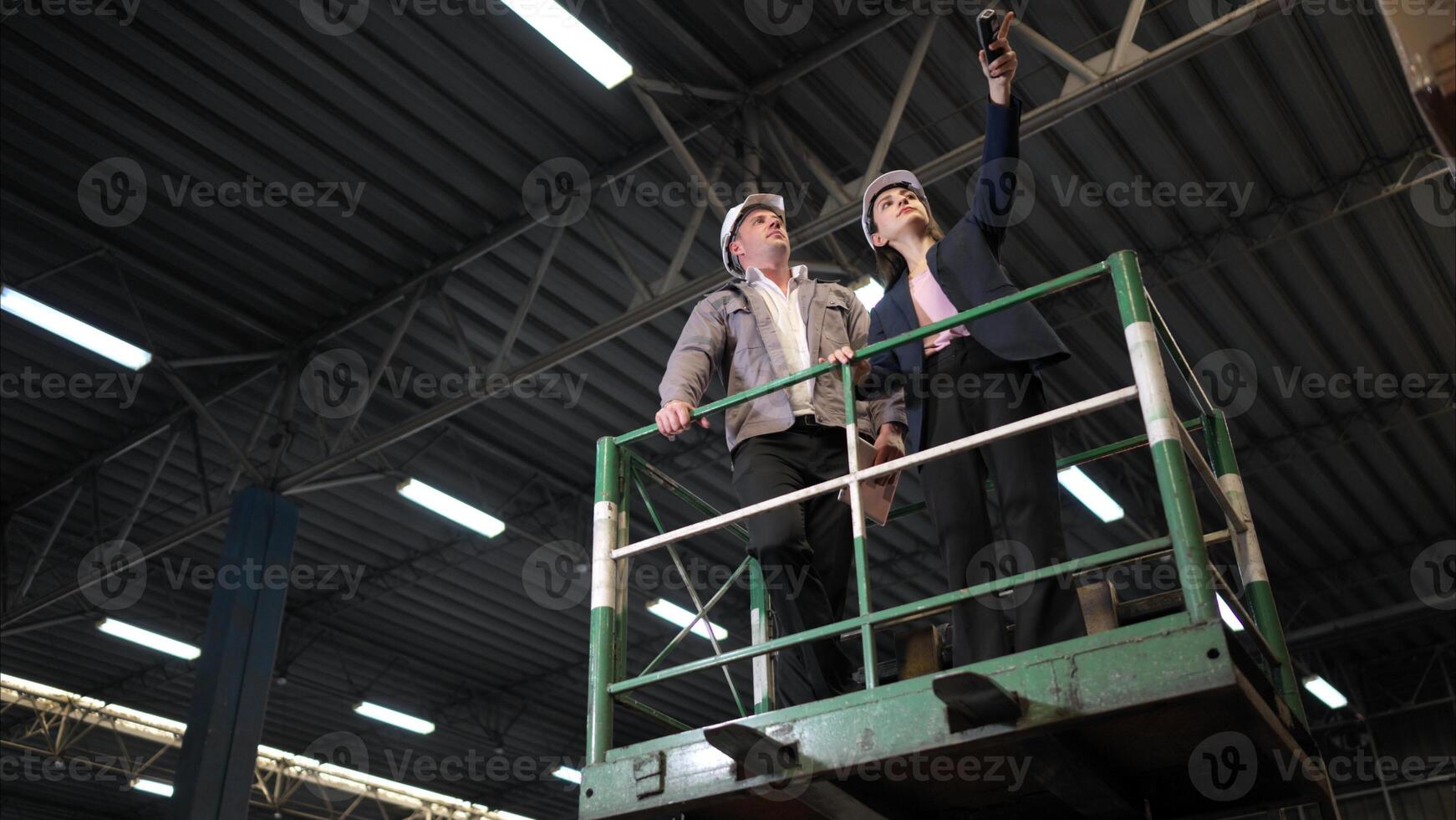Business woman and warehouse workers are reviewing the list of items based on the documentation,150 photo