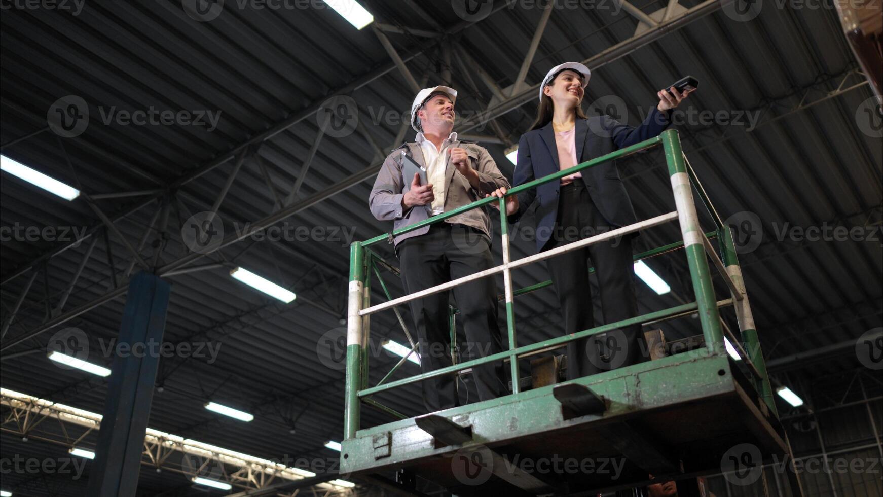 Business woman and warehouse workers are reviewing the list of items based on the documentation,137 photo