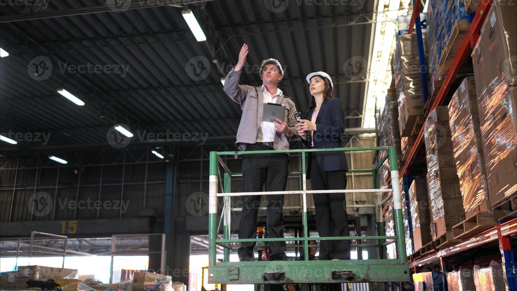 Business woman and warehouse workers are reviewing the list of items based on the documentation,99 photo