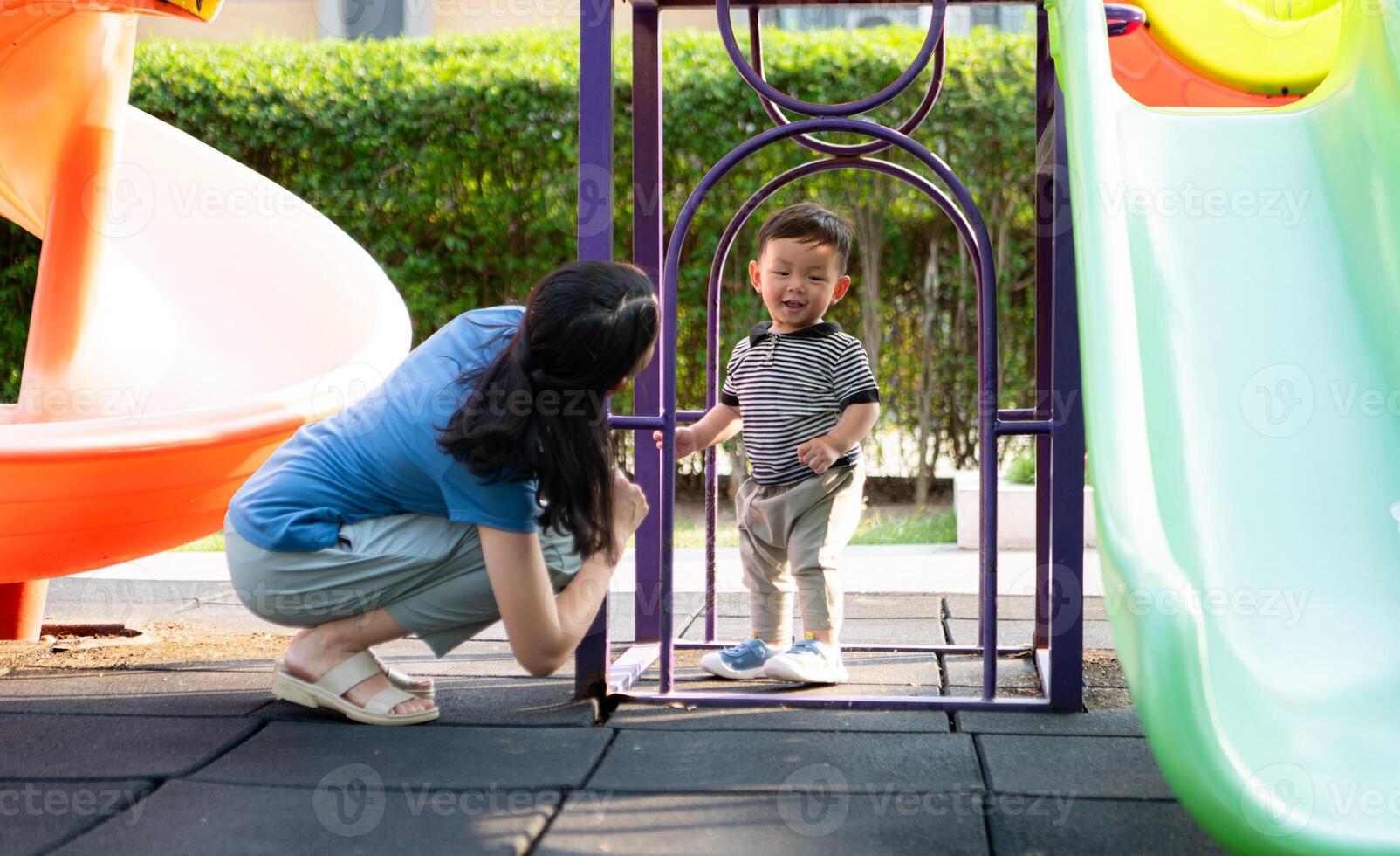 While in vacation at home, a mother engages in activities with little kid in the park,34 photo