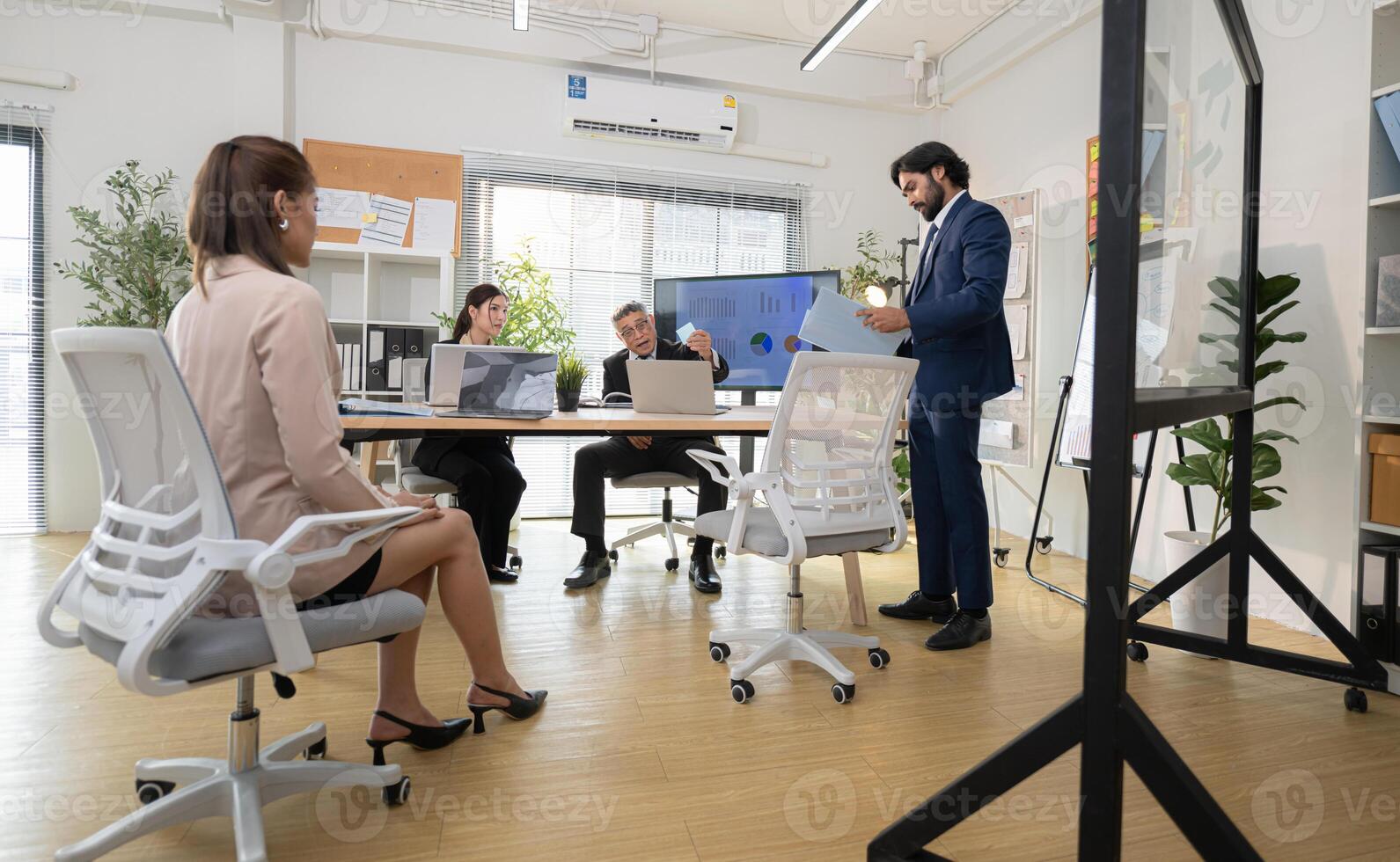 In a contemporary office, a group of senior executives with a mission to approve new projects,186 photo