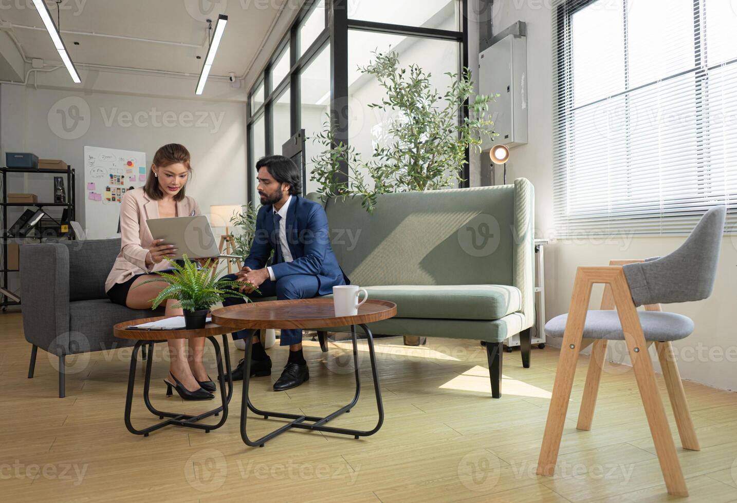In a contemporary office, boss and assistant are on a mission to monitor the progress,174 photo