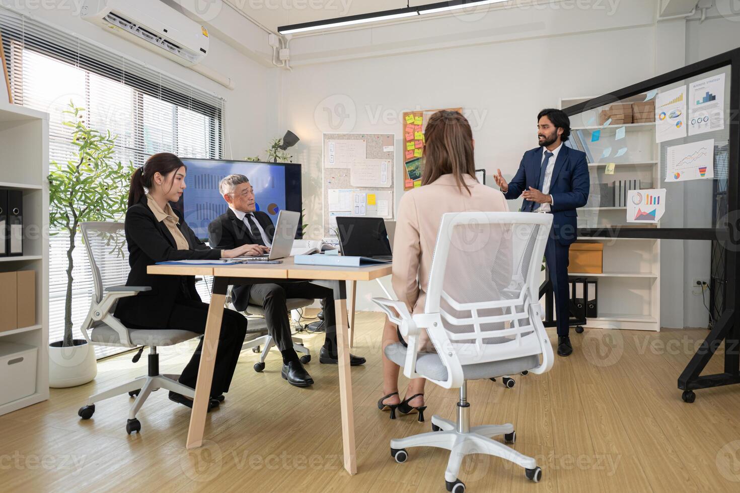 In a contemporary office, a group of senior executives with a mission to approve new projects,129 photo