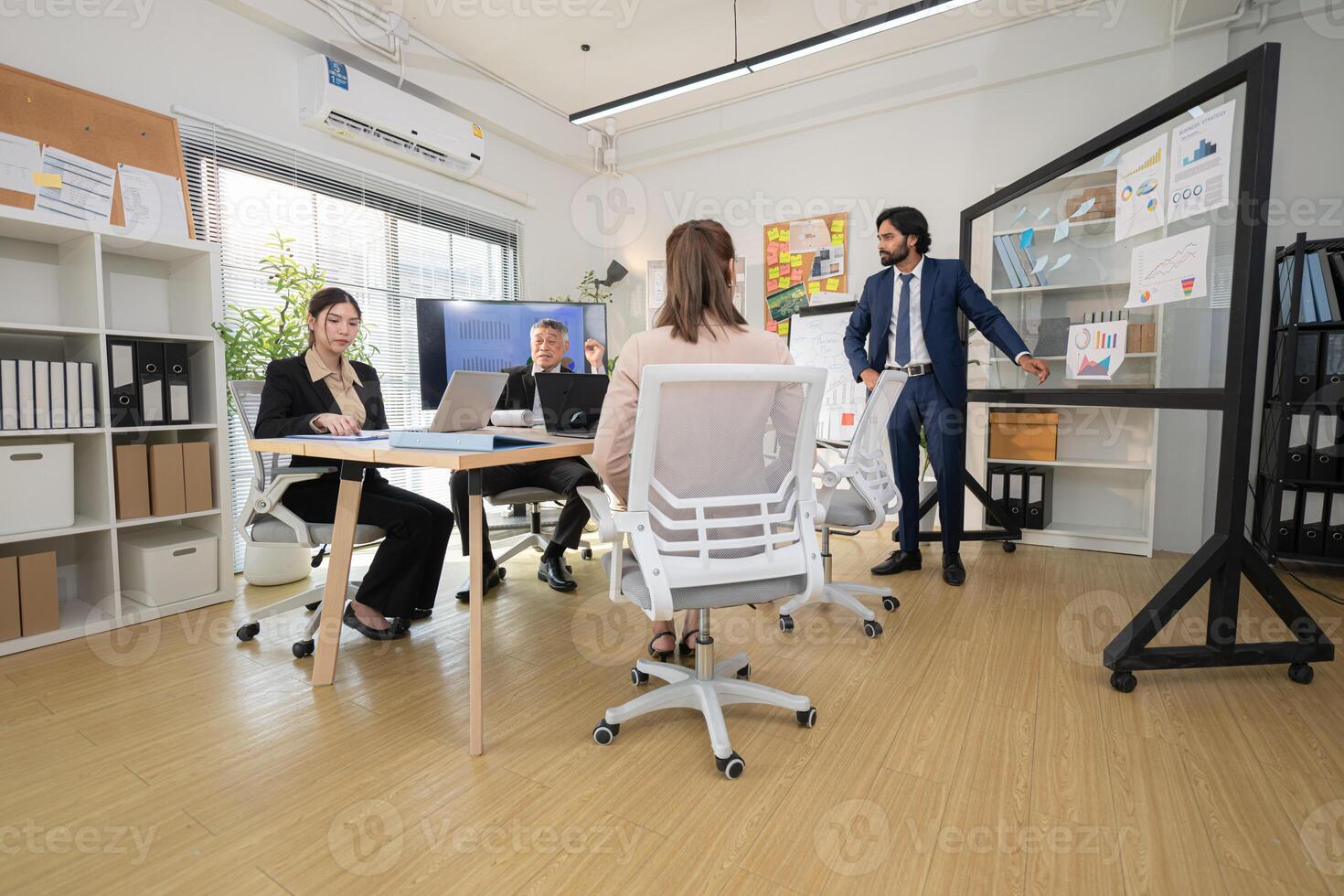 In a contemporary office, a group of senior executives with a mission to approve new projects,105 photo