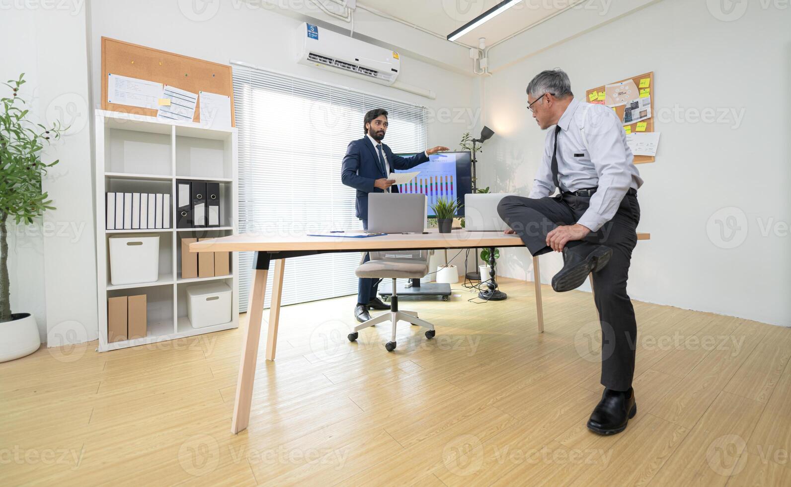 In a contemporary office, two senior executives with a mission to brainstorm and monitor,98 photo