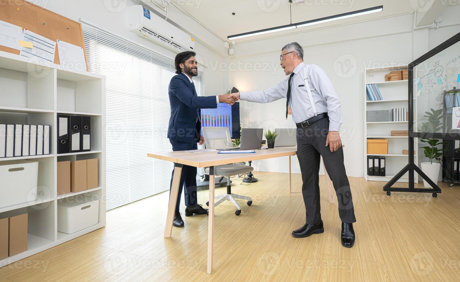 In a contemporary office, two senior executives with a mission to brainstorm and monitor,81 photo