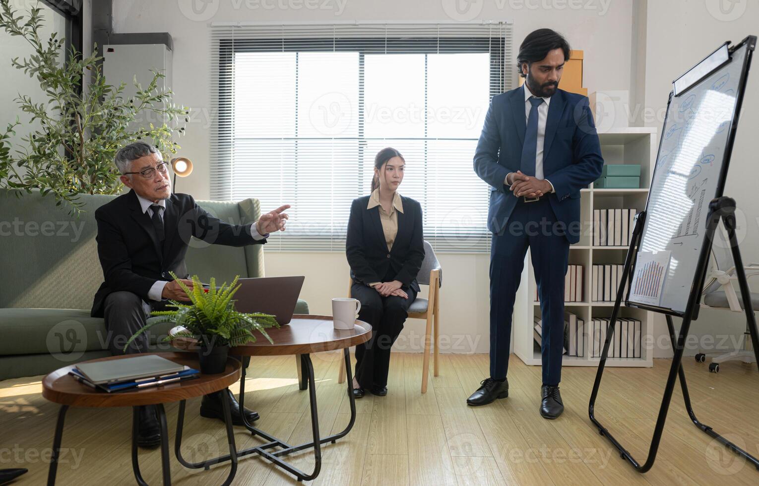 In a contemporary office, a group of senior executives with a mission to approve new projects,40 photo
