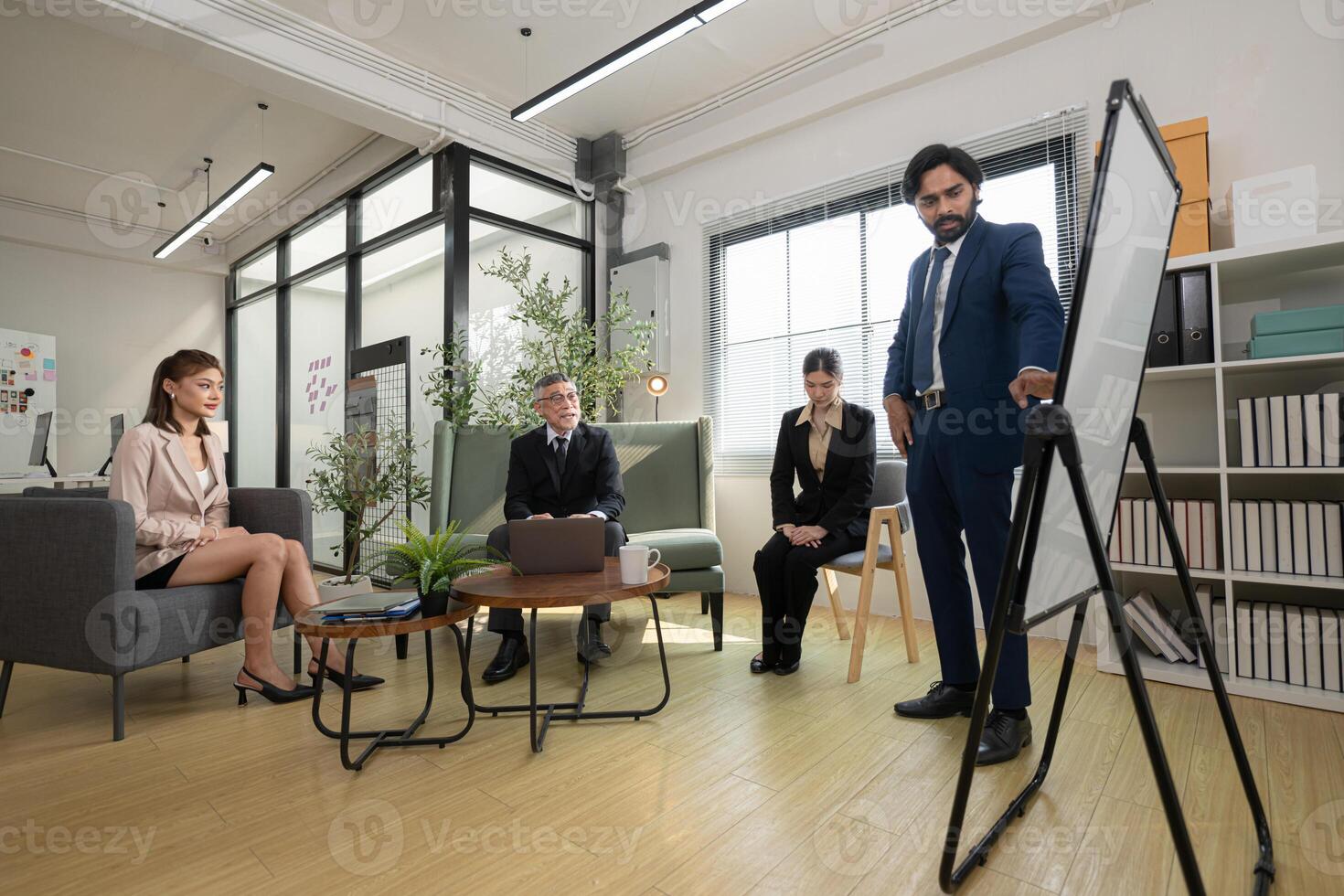 In a contemporary office, a group of senior executives with a mission to approve new projects,9 photo